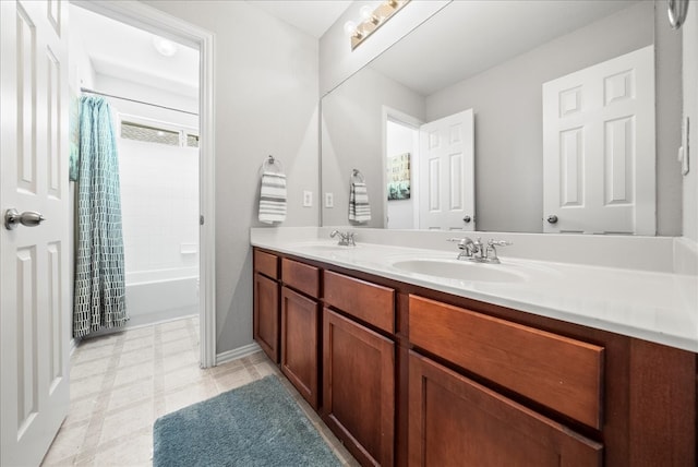 bathroom with shower / tub combo with curtain and vanity