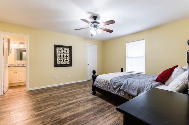 bedroom featuring ceiling fan, hardwood / wood-style flooring, and connected bathroom