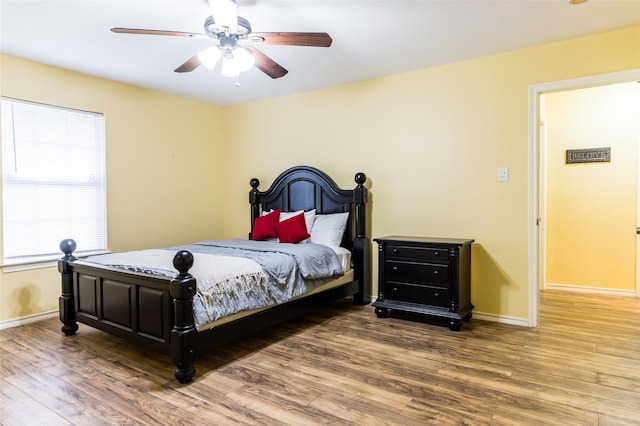 bedroom featuring ceiling fan and hardwood / wood-style flooring