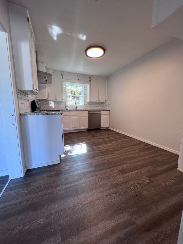 kitchen with tasteful backsplash, dark hardwood / wood-style flooring, range, stainless steel dishwasher, and white cabinetry