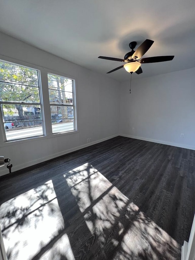 unfurnished room featuring ceiling fan and hardwood / wood-style floors