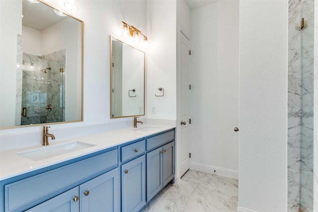 bathroom with marble finish floor, a sink, a marble finish shower, and double vanity