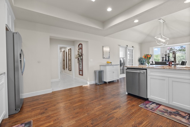 kitchen with white cabinets, stainless steel appliances, and dark hardwood / wood-style flooring