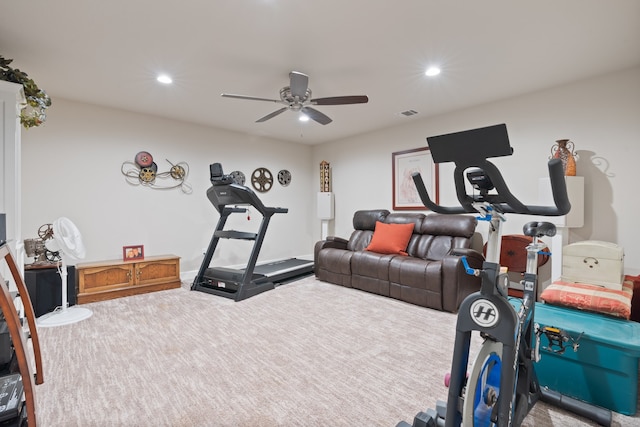 workout area featuring ceiling fan and carpet floors