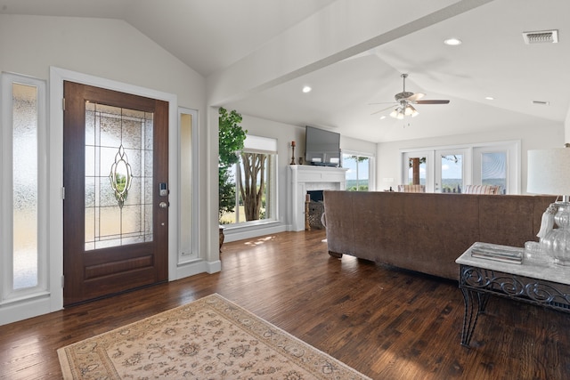 entryway with ceiling fan, plenty of natural light, dark hardwood / wood-style flooring, and lofted ceiling