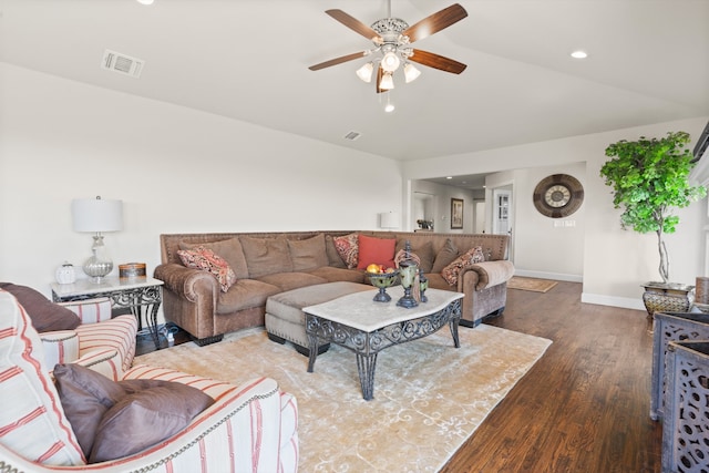 living room featuring ceiling fan, vaulted ceiling, and wood-type flooring