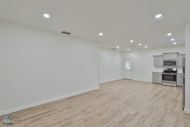 unfurnished living room with light wood-type flooring