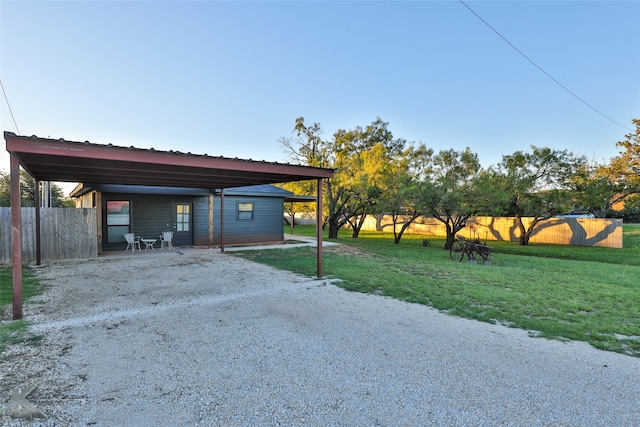 exterior space with a yard and a carport