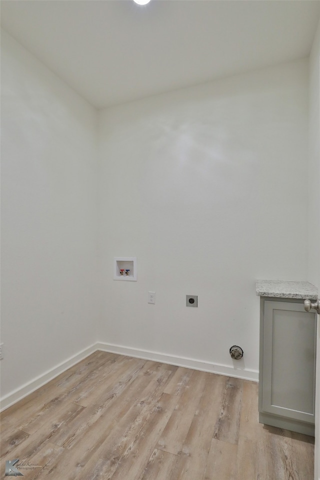 laundry area featuring washer hookup, light wood-type flooring, and electric dryer hookup