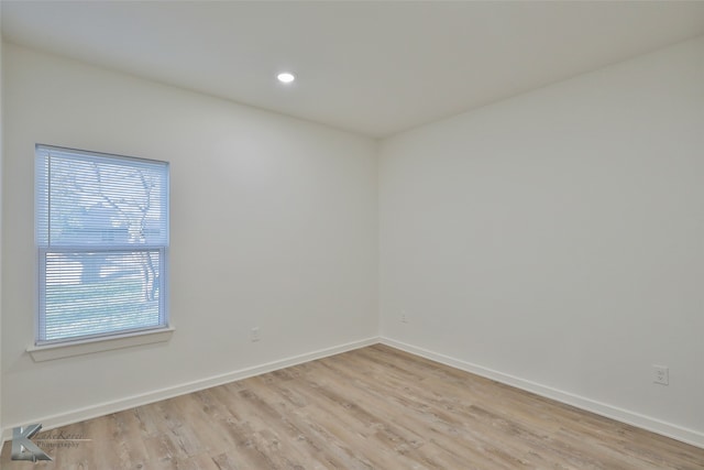 spare room with light wood-type flooring