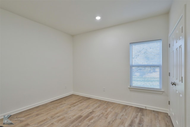 spare room featuring light wood-type flooring