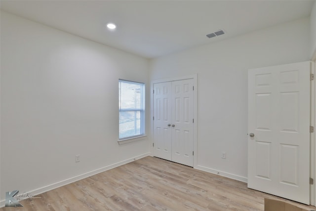 empty room with light wood-type flooring