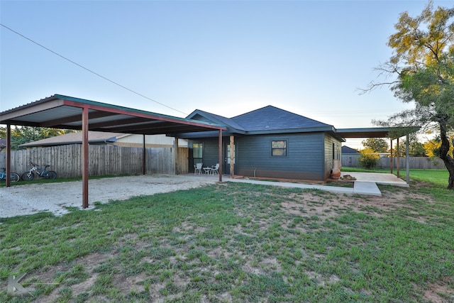 rear view of property with a yard