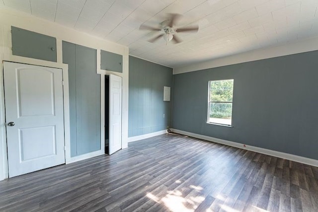 unfurnished bedroom with ceiling fan and dark hardwood / wood-style floors