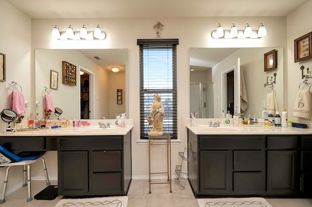 bathroom featuring vanity, tile patterned flooring, and a shower with door