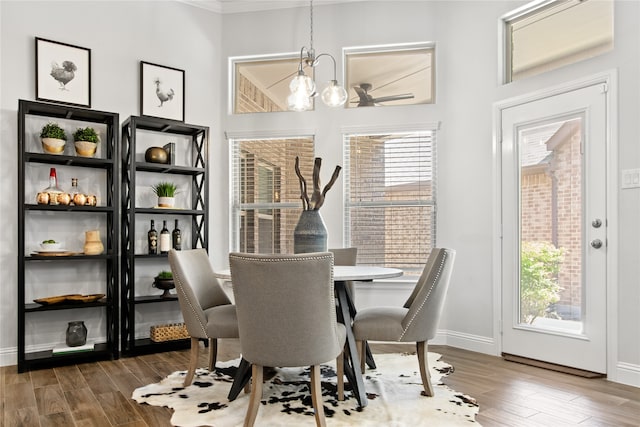 dining area with a notable chandelier and wood-type flooring