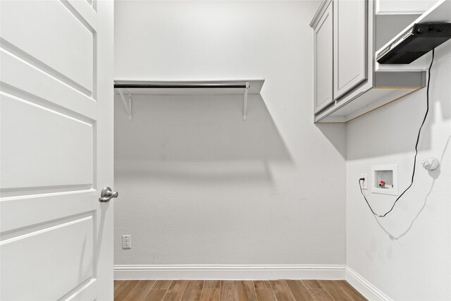 spacious closet featuring light hardwood / wood-style floors