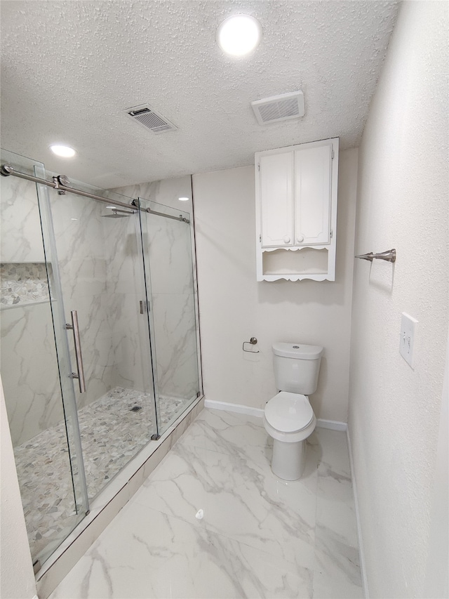 bathroom featuring toilet, walk in shower, tile patterned flooring, and a textured ceiling