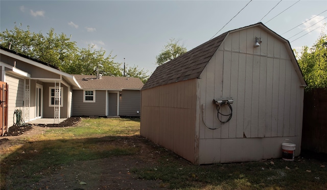 view of outbuilding featuring a lawn