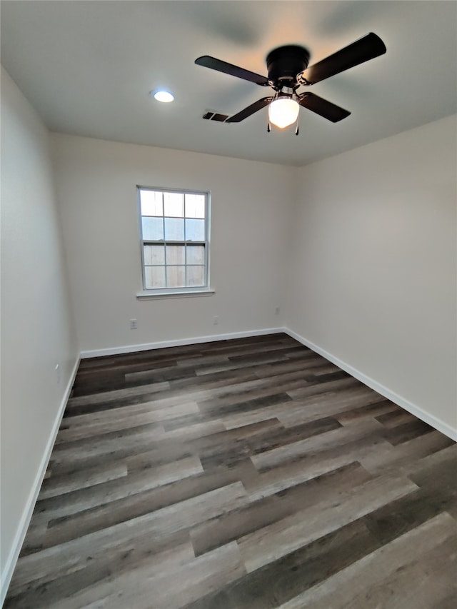 empty room featuring ceiling fan and wood-type flooring