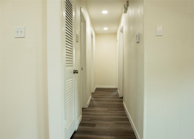 corridor featuring dark hardwood / wood-style flooring