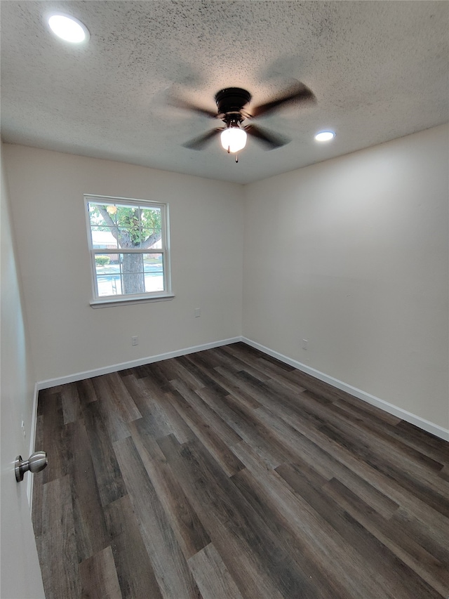 spare room featuring hardwood / wood-style flooring, a textured ceiling, and ceiling fan