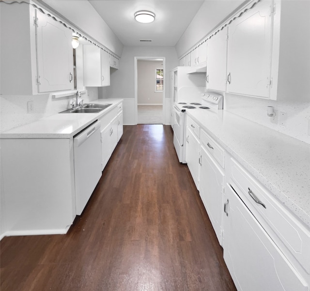 kitchen featuring white cabinetry, sink, dark hardwood / wood-style flooring, and white appliances