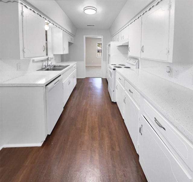 kitchen featuring white cabinetry, sink, white appliances, and dark hardwood / wood-style floors