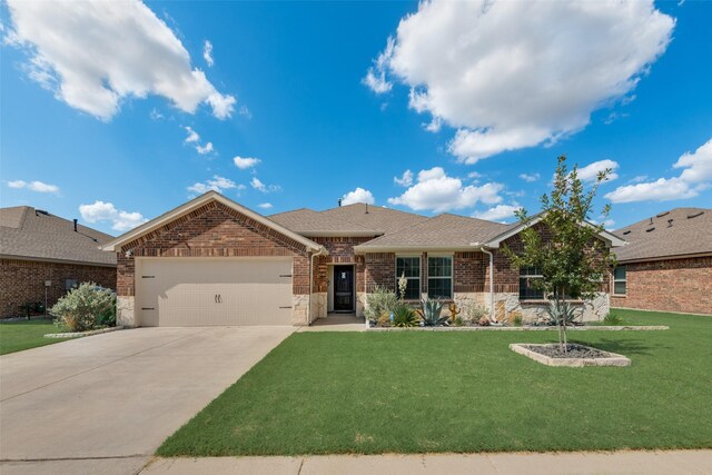 ranch-style home with a garage and a front lawn