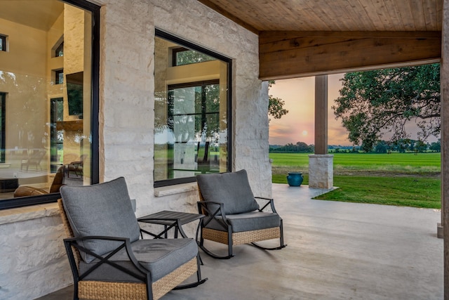 patio terrace at dusk with a yard