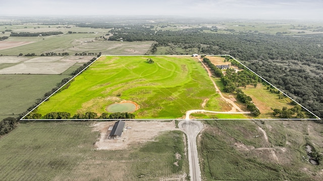 birds eye view of property featuring a rural view