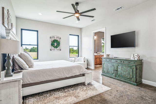 bedroom featuring ensuite bathroom and ceiling fan