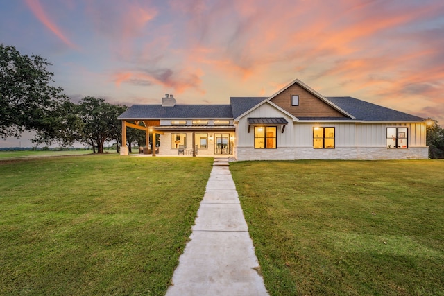 view of front of property with a yard