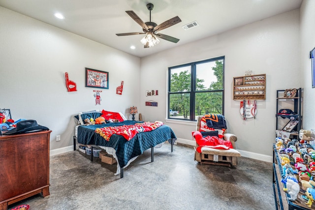 bedroom with ceiling fan and concrete floors