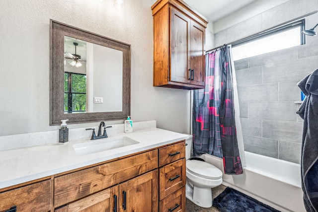 full bathroom with ceiling fan, vanity, shower / tub combo with curtain, and toilet