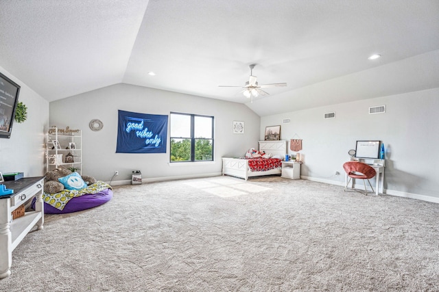 carpeted bedroom with ceiling fan and vaulted ceiling