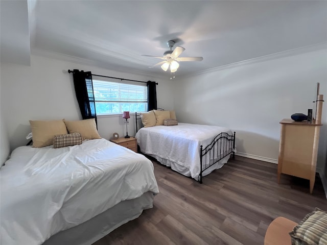 bedroom featuring crown molding, ceiling fan, and dark hardwood / wood-style floors