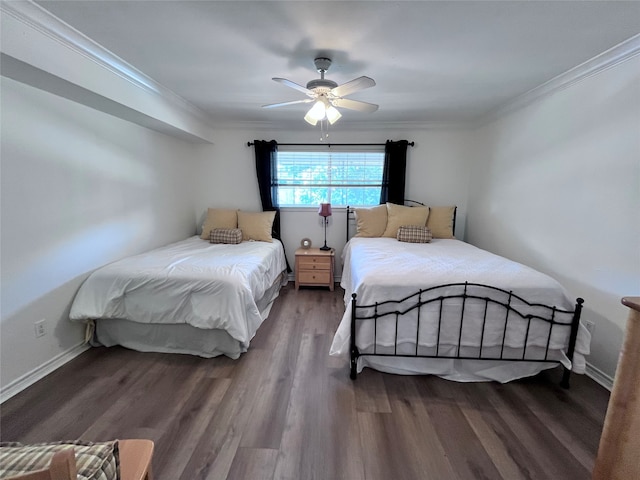 bedroom with dark wood-type flooring, ceiling fan, and crown molding