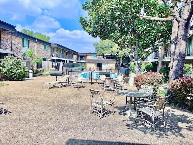 view of patio featuring a balcony