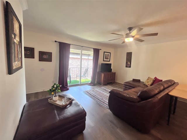 living room featuring dark hardwood / wood-style flooring and ceiling fan