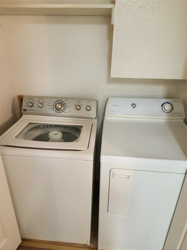 laundry area featuring washing machine and clothes dryer