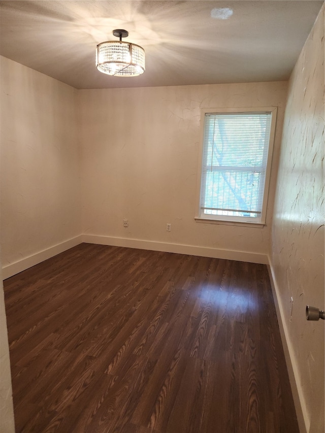 empty room with wood-type flooring