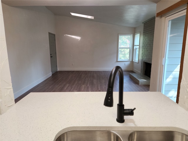 interior space with dark hardwood / wood-style floors and sink