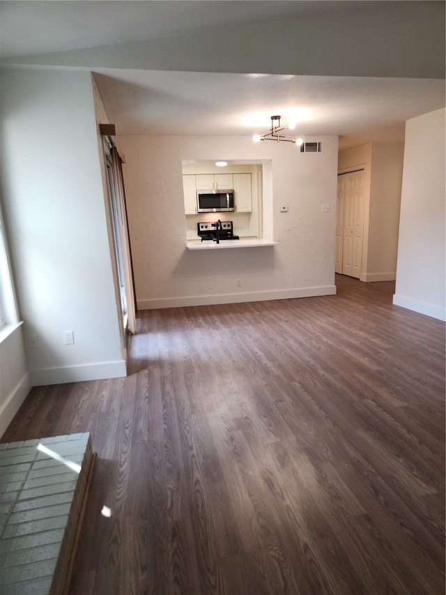 unfurnished living room featuring hardwood / wood-style flooring