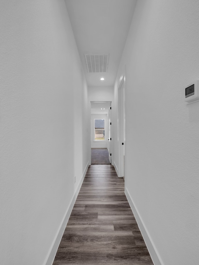 hallway featuring dark hardwood / wood-style floors