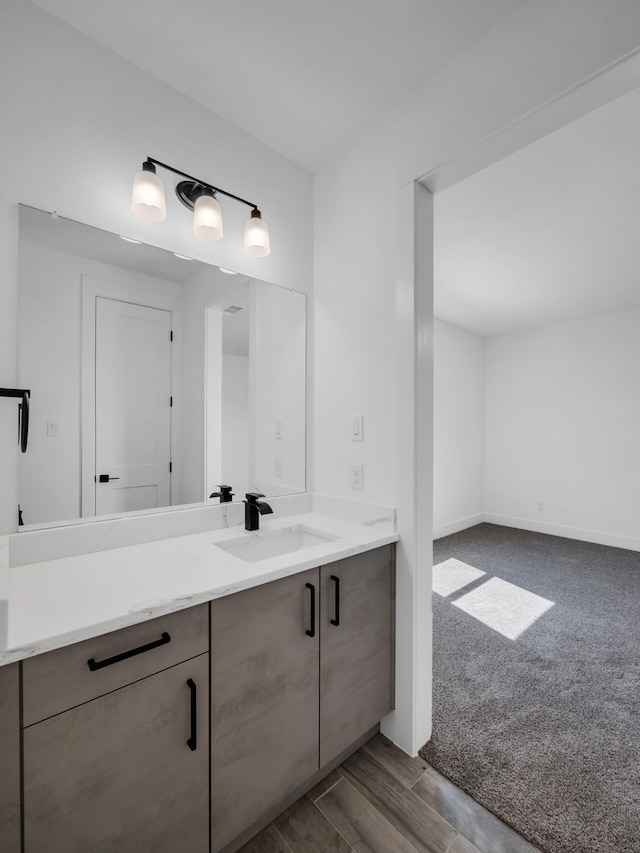 bathroom featuring vanity and hardwood / wood-style floors