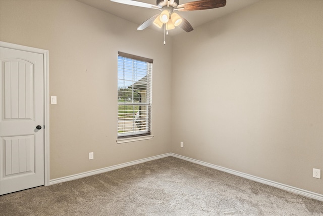 empty room with ceiling fan and carpet floors