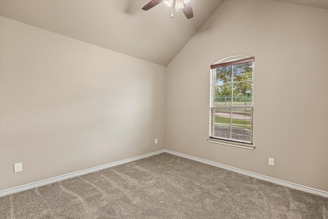 empty room featuring high vaulted ceiling, ceiling fan, and carpet floors