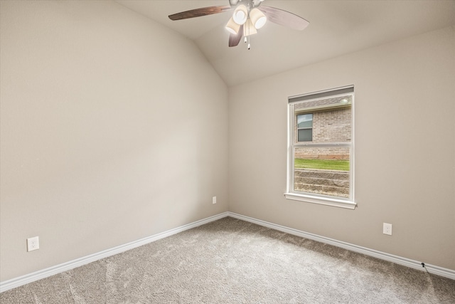 spare room with lofted ceiling, carpet flooring, and ceiling fan