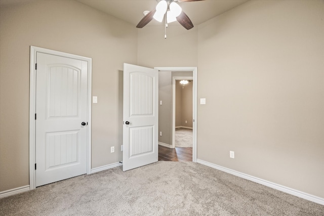 unfurnished bedroom featuring light colored carpet and ceiling fan